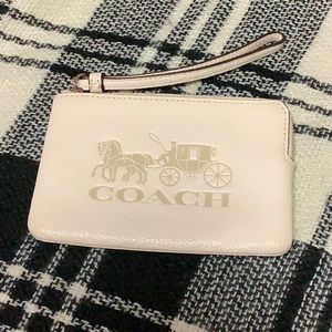 Coach off white embossed zip corner wristlet
